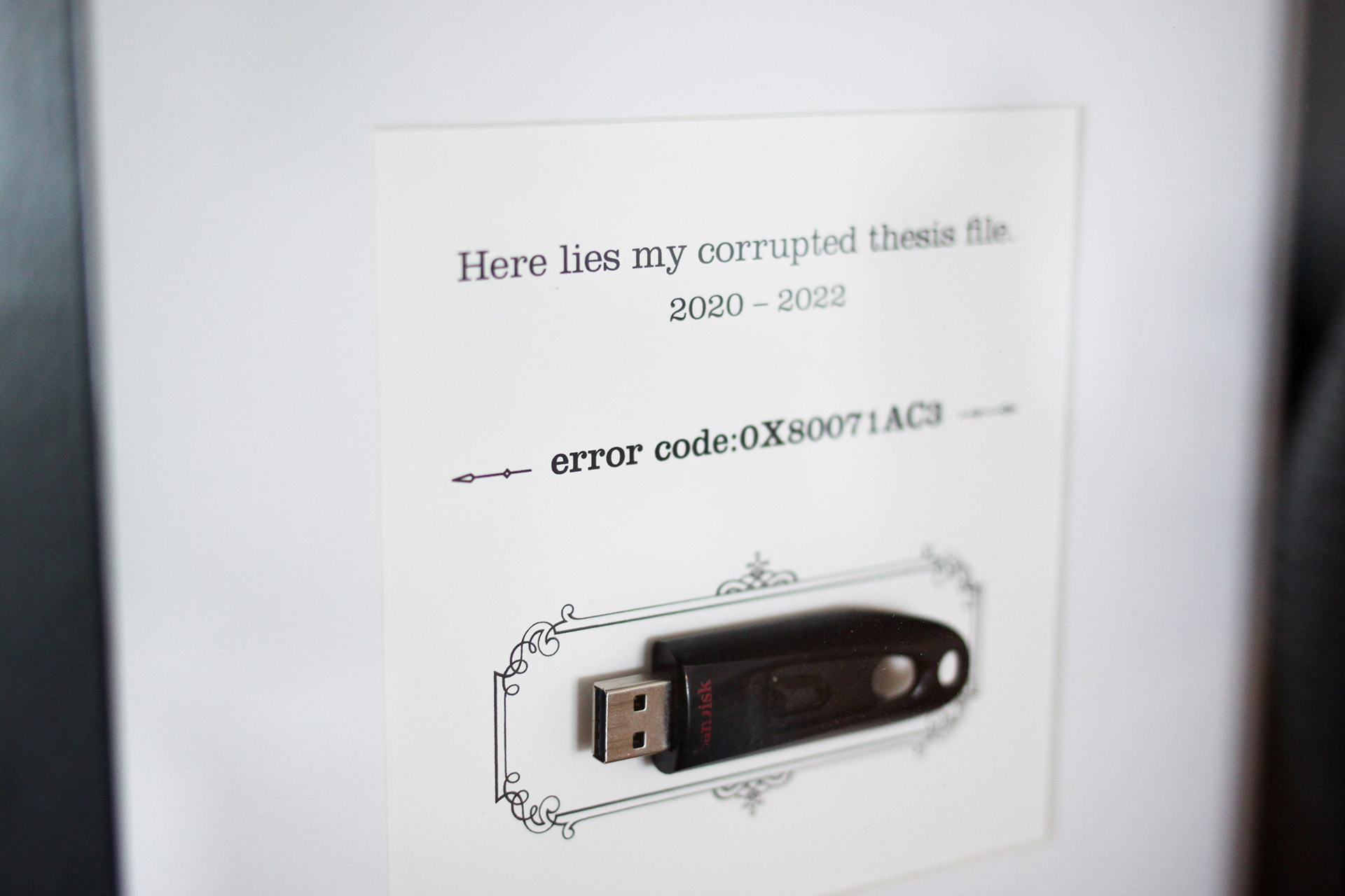 A corrupted USB drive within a frame with its error code